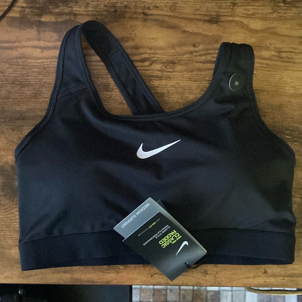 Women’s black BNWT size medium sports bra.  See pictures for details $30 obo